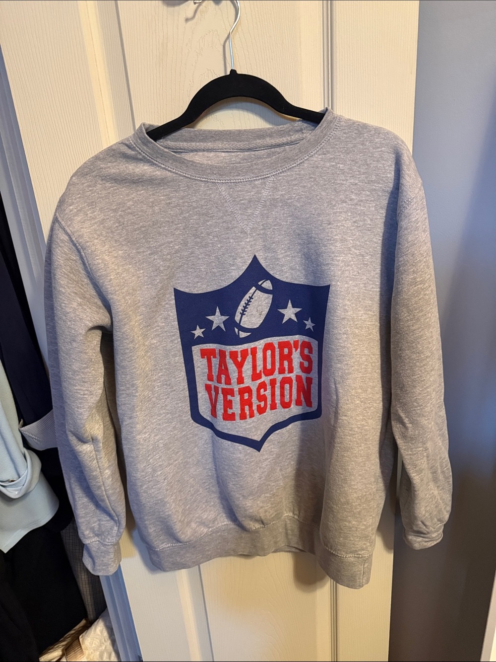 Gray Crewneck Sweatshirt with Blue & Red Football Shield Graphic